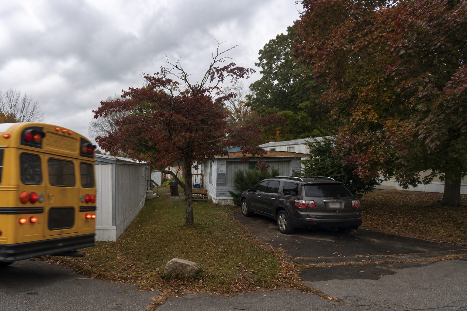 Country Estates trailer park — the tail of a yellow school bus leaving on an overcast autumn day