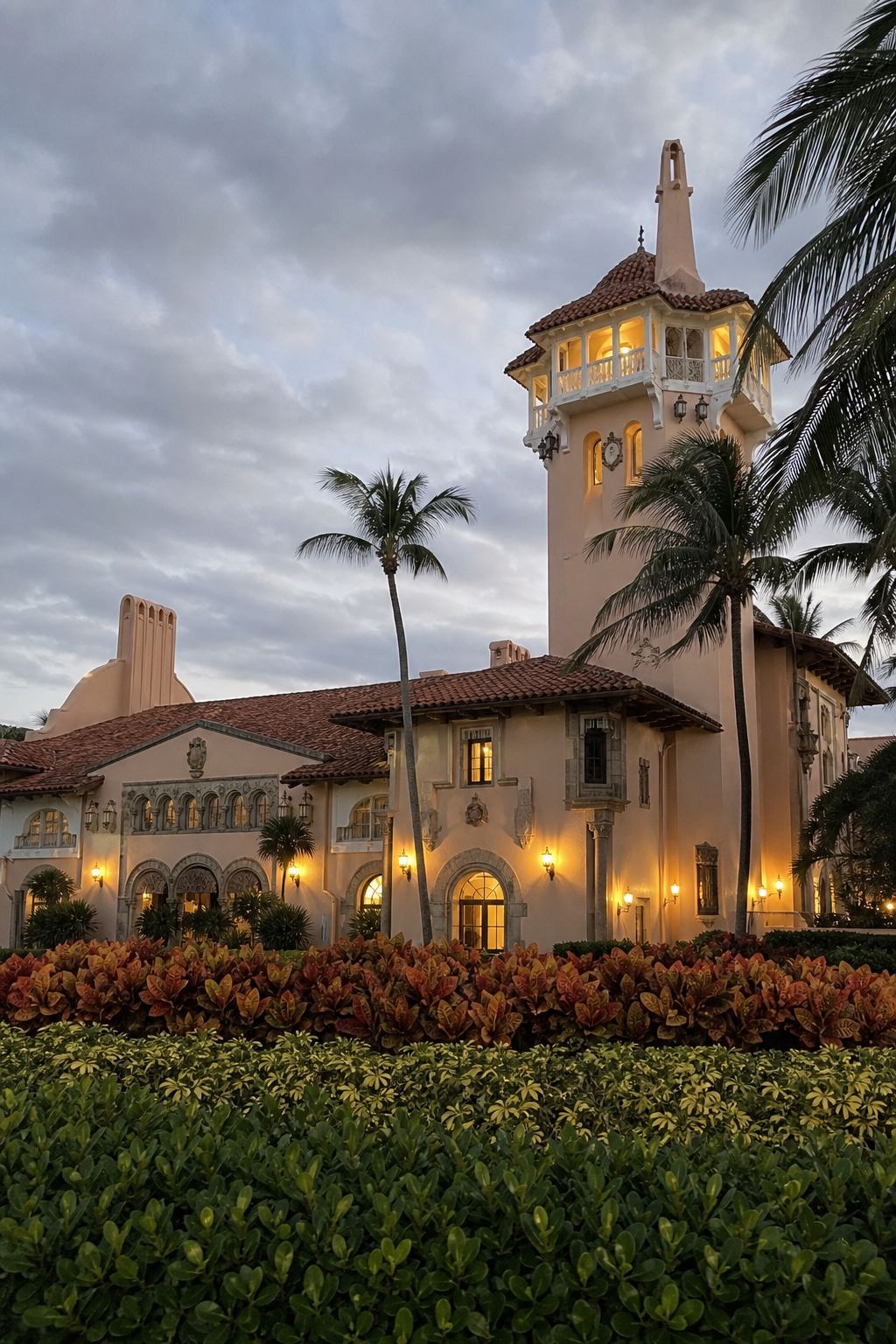 Mar-a-Lago at dusk — the tower, palms, and warm lights on April 25, 2026